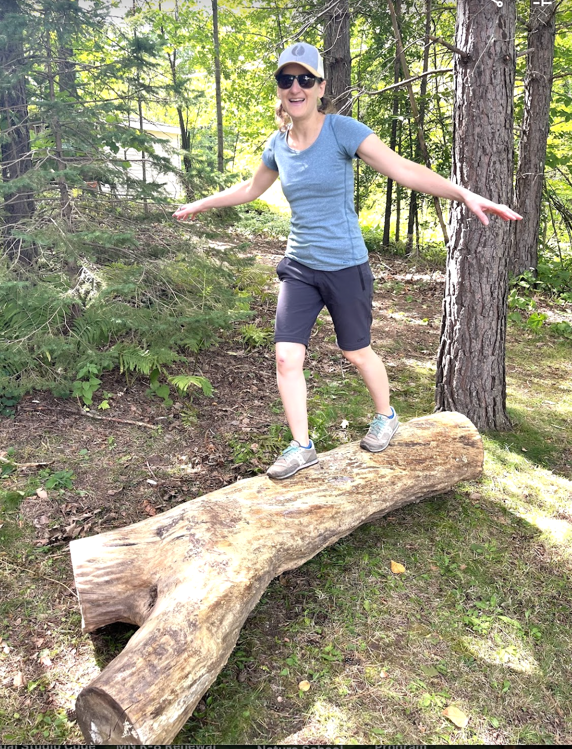 Child balancing on a log