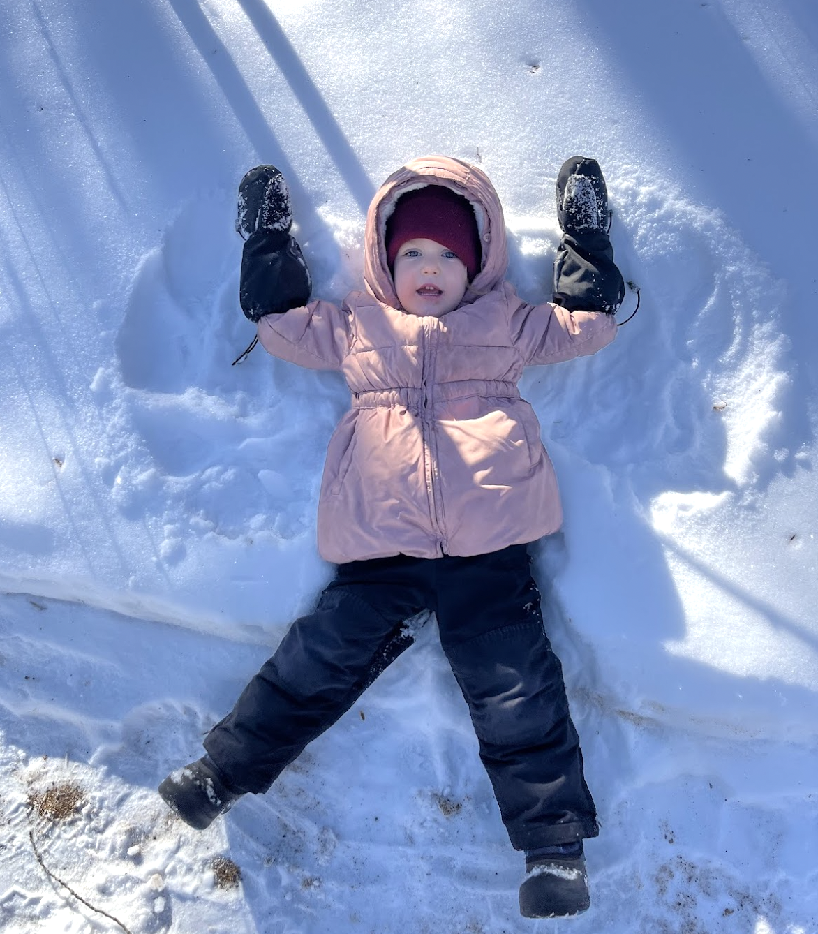 Child making a snow angel